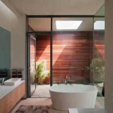 Modern Bathroom With Glass Wall & Soaking Tub 