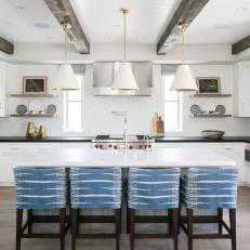 Crisp White Kitchen Features Blue Accent Barstools