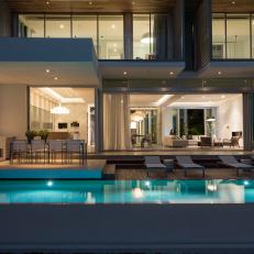 Modern Outdoor Deck and Dining Area With Pool