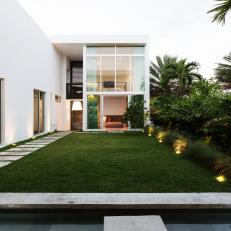 Grassy Courtyard and Modern Home Exterior