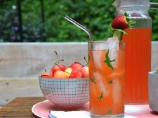 Summer Cocktail With Strawberry and Cucumber on a Porch