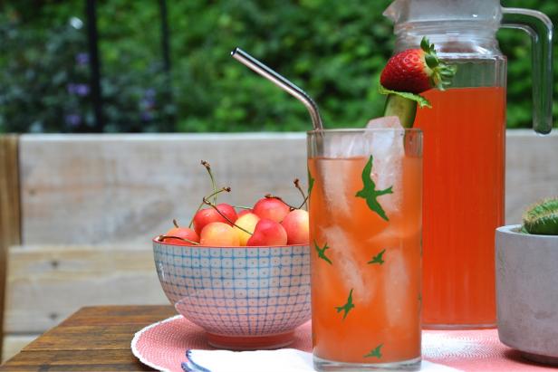 Summer Cocktail With Strawberry and Cucumber on a Porch
