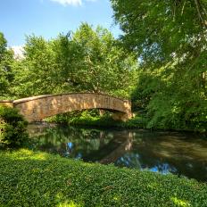 Decorative Stone Bridge Over A Pond
