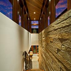 Contemporary Stairway with Stack Stone Wall