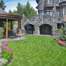 Stunning Stone Mansion With Lush Landscaped Yard