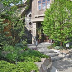 Home Entry With Natural Elements and Stone Walkway
