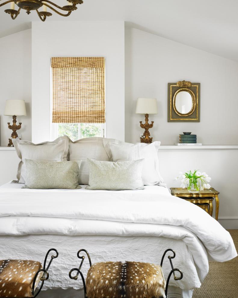 White Master Bedroom with Animal Print Stools