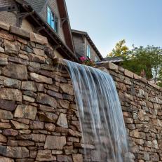Waterfall Flows Over Retaining Wall