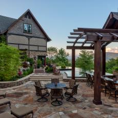 Rustic Patio With Wrought Iron Furnishings & Outdoor Bar