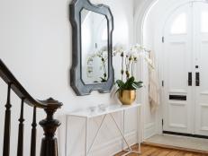 White, Eclectic Foyer With Arched Front Doors