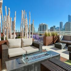 Neutral Urban Roof Deck With Wicker Love Seat