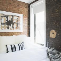 Urban Bedroom Features Varying Hues of Exposed Brick