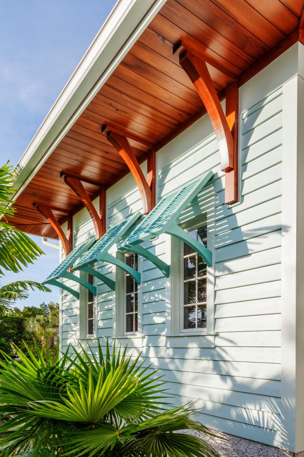 Home Exterior With Neutral Siding, Blue Shutters and Wood Soffit