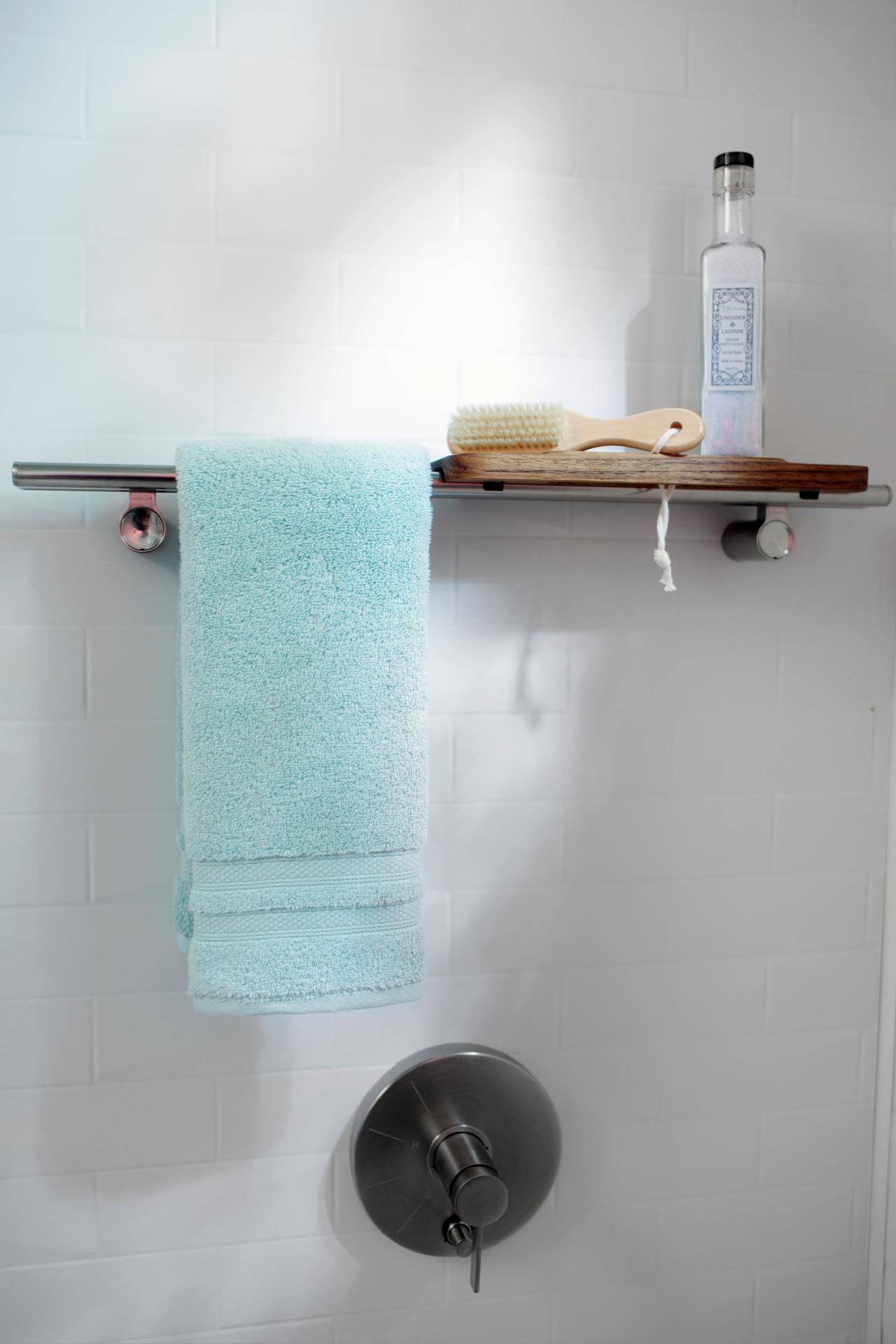 https://hgtvhome.sndimg.com/content/dam/images/hgtv/fullset/2015/6/30/1/uo2015_guest-bathroom-interior-shower-tile-shlef-towel-brush_v.jpg.rend.hgtvcom.1280.1920.suffix/1435690473918.jpeg