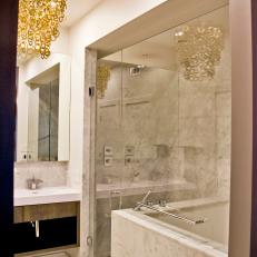 Modern White Bathroom With Glass-Enclosed Marble Shower