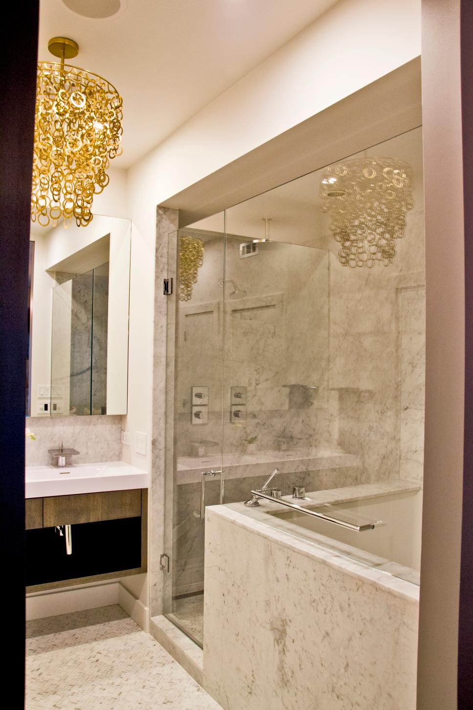 Modern White Bathroom With Glass-Enclosed Marble Shower | HGTV