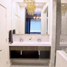 Modern Bathroom With Metallic Chandelier and Marble Floor