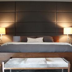 Modern Master Bedroom with Fabric Panels on the Walls and Upholstered Bench