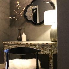 Modern Dressing Area with Globe Light Hanging Fixture, Inlaid Wood Table and Flokati Cushion 