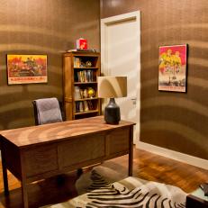 Brown Home Office with Hanging Globe Lamp, Zebra-print Rug and Asian Posters