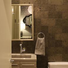 Modern Powder Room with Stone Tile Backsplash, Floating Vanity and Modern Fixtures
