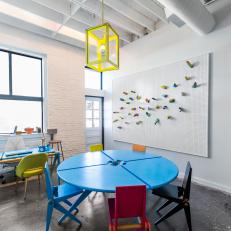 White Dormitory Dining Area With Colorful Table And Chairs