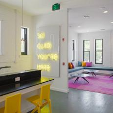 Dormitory Lounge And Study Area With Banquette Seating And Colorful Pillows