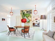 Country Living Space With White Paneled Walls and Vegetable Mural