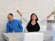 As seen on Brother vs. Brother, guest judges and hosts of "Love It or List It" designer Hilary Farr (R) reacts after defeating realtor David Visentin in a game of  "Rock, Paper & Scissors" to break their impasse on which brother won the bedroom and bathroom challenge. The winning brother got to watch the other perform a humiliating dare.