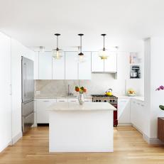 Modern White Open Plan Kitchen With Pendant Light Fixtures