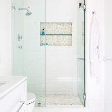 Spa-Like White Bathroom With Glass Tile And Marble Countertop