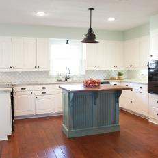Blue and White Cottage Kitchen With Blue Island