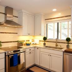 White Traditional Kitchen With Stainless Range 