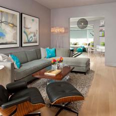 Posh Sitting Area Features Eames Chair & Bright Turquoise Accents