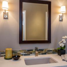 Contemporary Bathroom With Sconces And Glass Tile Detail 