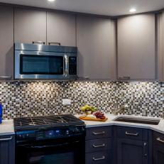 Small Contemporary Kitchen With Tile Backsplash And Dark Cabinets