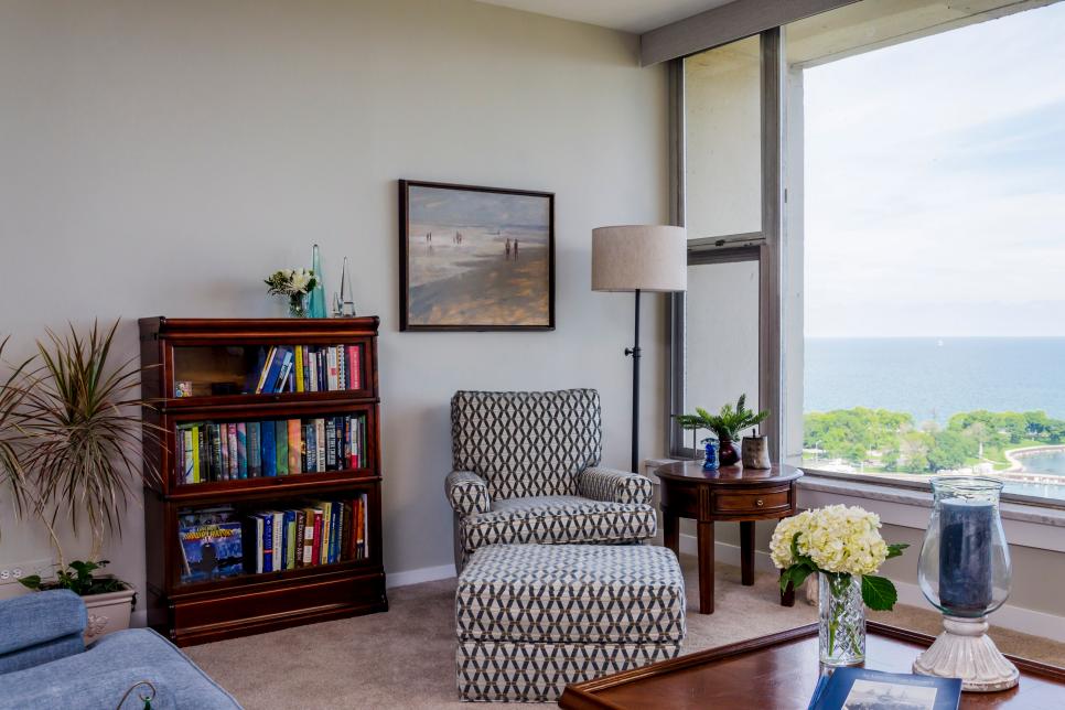 Traditional Style Living Room With Patterned Armchair And Ottoman | HGTV