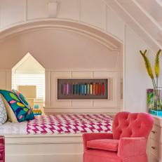 Multicolored Eclectic Bedroom With Pink Armchair