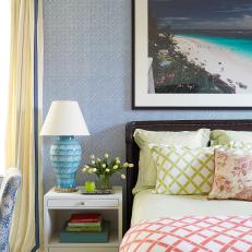 Blue and White Tropical Bedroom With Multicolored Bed