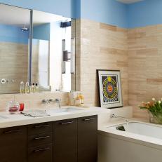 Blue and Neutral Bathroom With Rug