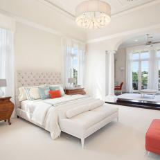 White Traditional Master Bedroom With Orange Bench