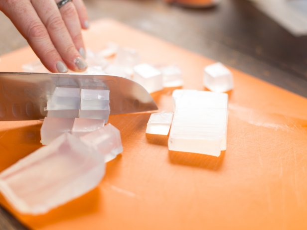 Cut the soap base into blocks, then smaller one inch pieces.