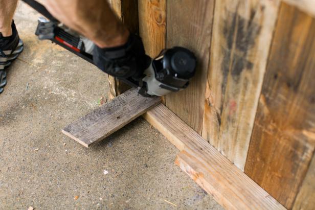 Using flat pallet boards, measure and mark each leg at 10 inches long (Image 8), then cut one end at a 90 degree angle and the other on a 15 degree angle (Image 9). Using a nail gun, secure the legs to the top corners of each frame, angled side down (Image 10).