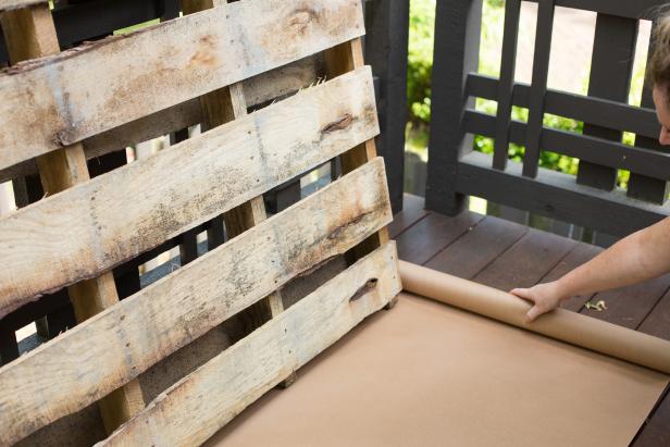 Place the pallet on top of craft paper or a drop cloth to protect floor surface