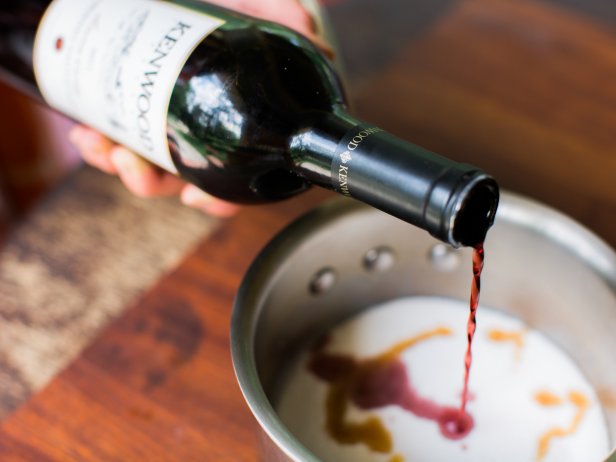 Woman Pouring Wine in Sauce Pan