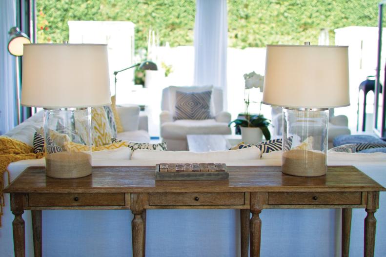 Wooden Console Table With Glass Lamps Filled With Sand