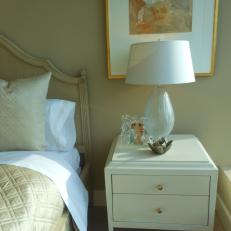 Crisp White Nightstand Boasts Chic Gold Accents