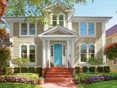 Neutral Traditional Home Exterior With Bright Blue Door