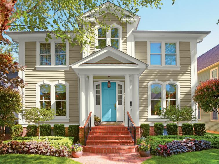 Neutral Traditional Home Exterior With Bright Blue Door