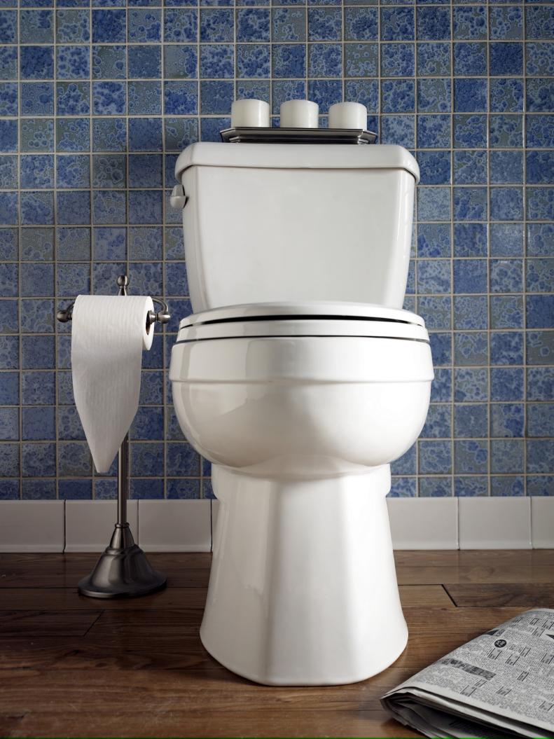 Toilet on Blue Tile Background